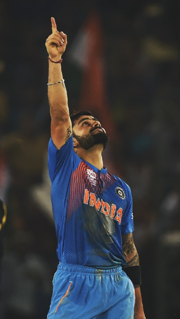 Virat Kohli standing with finger pointed to the sky after his 82* chase masterclass vs Australia in Mohali