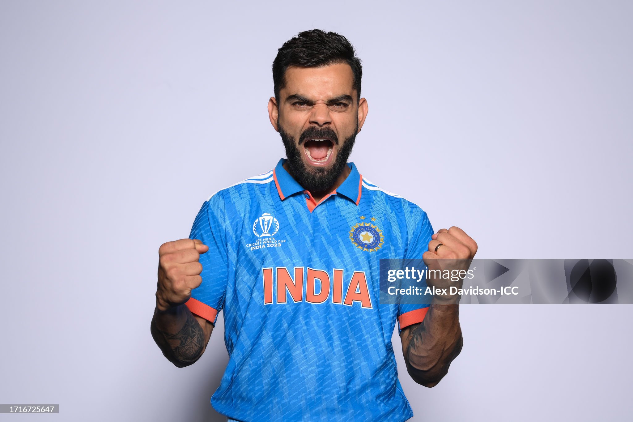 Virat Kohli celebrating with triumphant roar and clenched fist